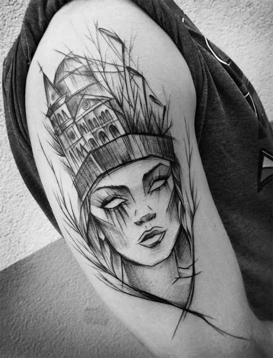 A foto da tatuagem de uma menina no estilo gráfico no ombro do cara