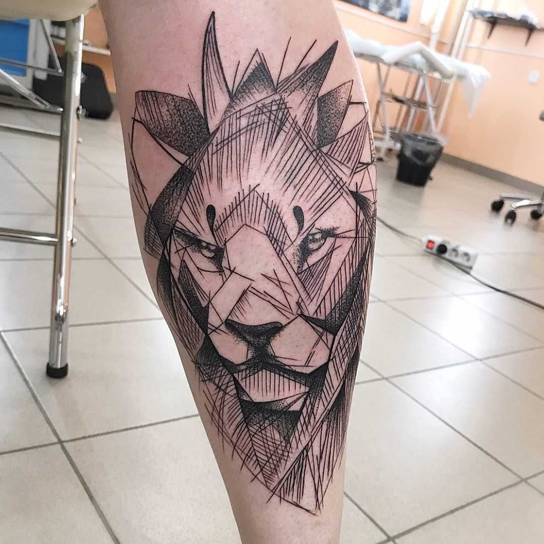 Fotos de tatuagem de leão no estilo de um gráfico sobre a perna de um cara