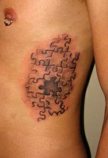 Tatuagem nas costelas cara de quebra - cabeças