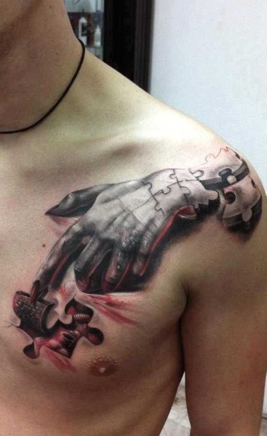 Tatuagem no peito e o ombro de um cara de quebra - cabeças
